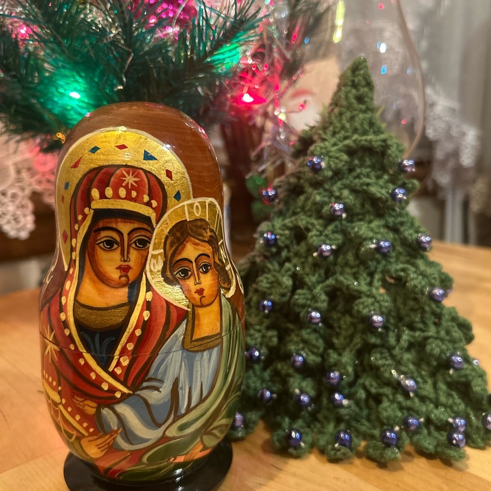 Hand-Painted Russian Nesting Doll with Religious Iconography

New